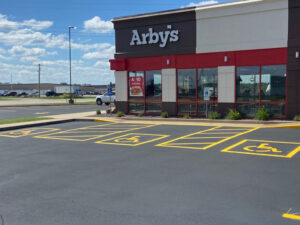 Wells Asphalt Sealcoat Parking Lot Striping and Marking Services - Madison County, Jersey County, Macoupin County, St Clair County, St Charles County, Lincoln County, Warren County, St Louis County, Green County, Jersey County